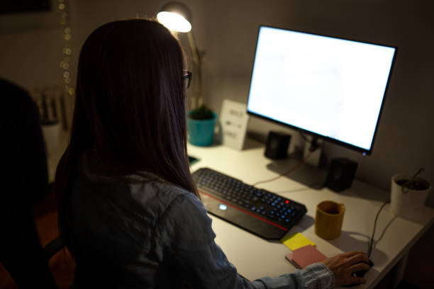 istock Woman working late at her home office 1180427078