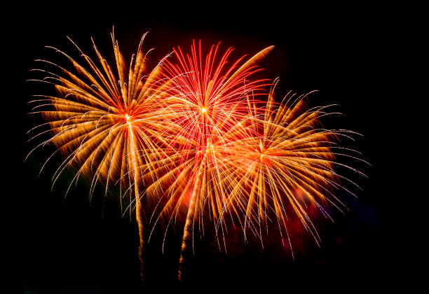 istock Beautiful colorful isolated firework display for celebration happy new year and merry christmas on black background 1180429873