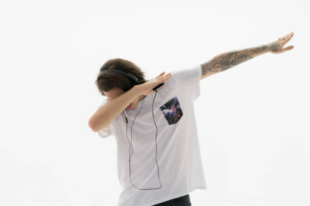 Young man makes the dab movement with his arms