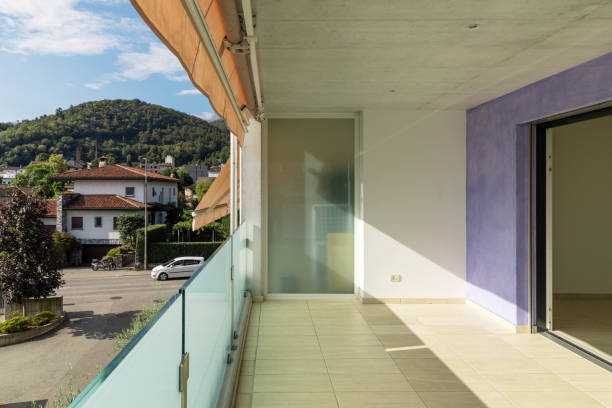 istock Balcony with travertine flooring, lilac facade 1180433968