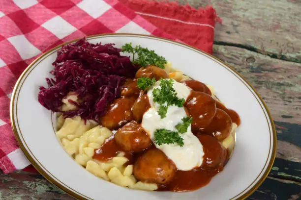 A vegetarian take on the classic Hungarian goulash stew made with mushrooms instead of meat, served with red cabbage and spaetzle dumplings.