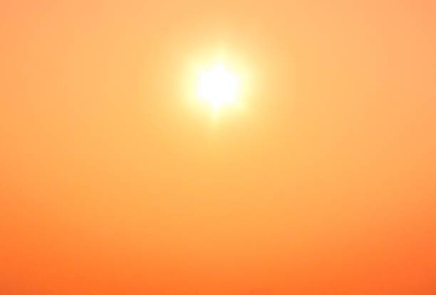 istock Shiny sun beam and orange sky in sand storm at noon 1180442586