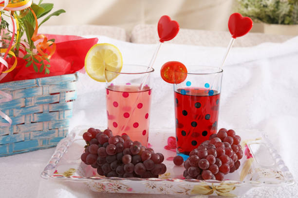 Fresh fruits and glasses of juice.