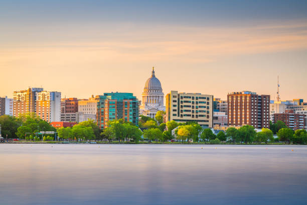 Madison, Wisconsin, USA downtown skyline Madison, Wisconsin, USA downtown skyline at dusk on Lake Monona. federal building photos stock pictures, royalty-free photos & images