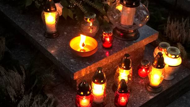 istock Burning candles on the grave 1180447303
