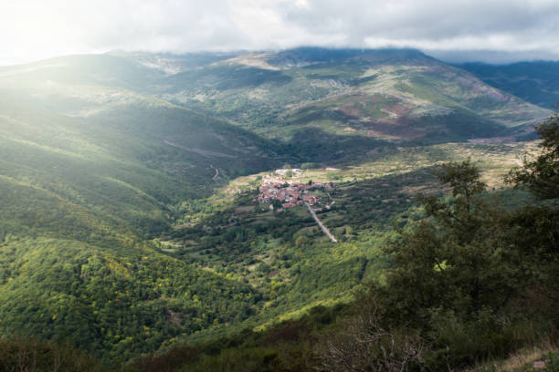 istock distant view of small a mountain town 1180447438