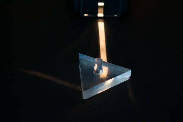 istock Science experiment. Demonstration of reflection of light in a prism. 1180451189