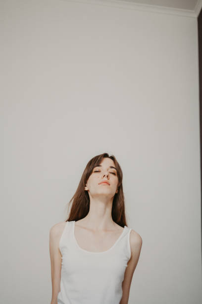 istock Young slender girl doing yoga 1180453860