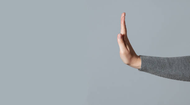 Stop gesture. Woman showing a refuse hand gesture sign. refusing stock pictures, royalty-free photos & images