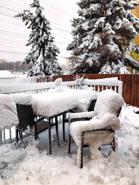 istock Patio Furniture Covered With Snow 1180461496
