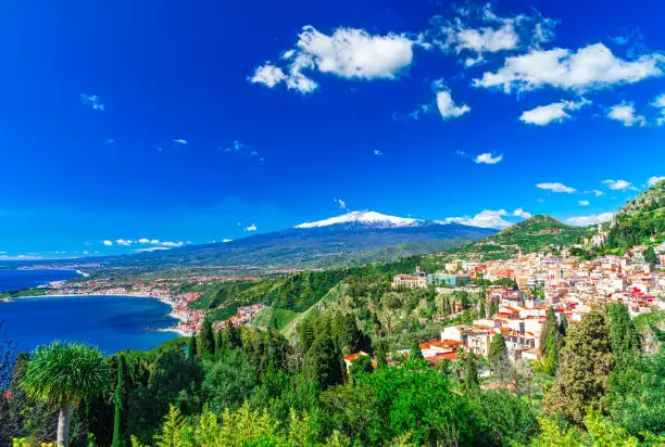 Taormina, Sicily, Italy: Panoramic view from the top of the Greek Theater, Giardini-Naxos with the Etna and Taormina, in a beautiful day.
