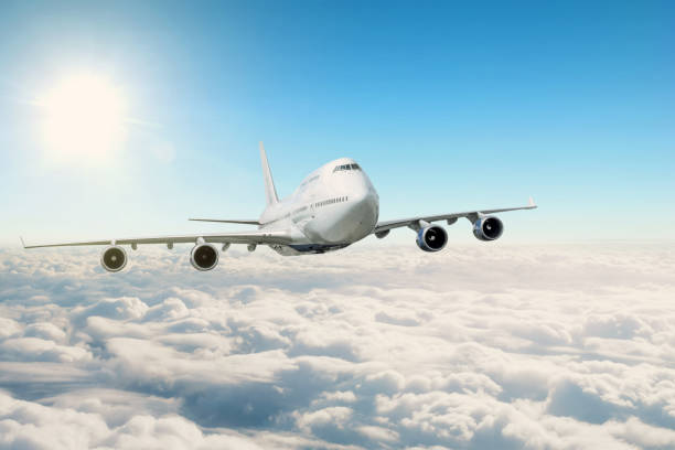 istock Passenger air plane flying in the daytime sky overcast, cloudscape. 1180466011