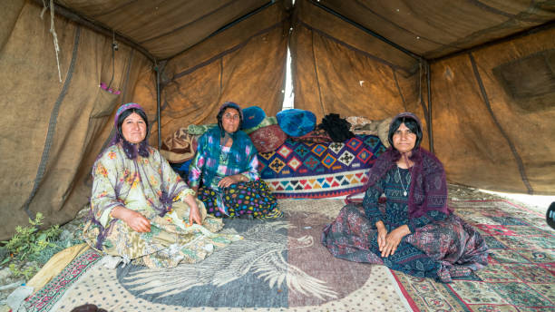Shiraz, Iran - May 2019: Qashqai nomadic women inside their tents. The Qasqhai are nomadic people living in temporary villages.