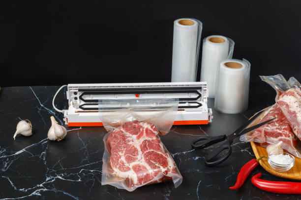 istock Vacuum sealer machine and meat Packed . 1180468772