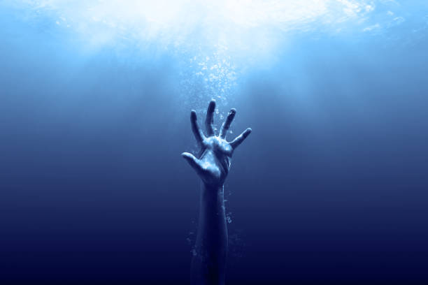 Save us out from the darkness hand drown in the water looking for help drowning photos stock pictures, royalty-free photos & images