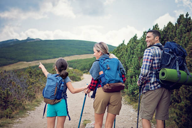 istock Happy family is hiking in the mountain 1180475246