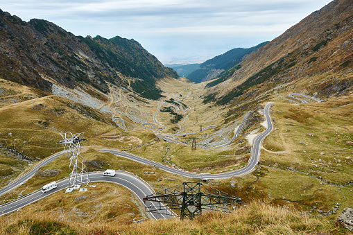 View of Transfagarash highway and valley in mountains of Romania. Tourist view mountain road. Autumn mountain landscape.