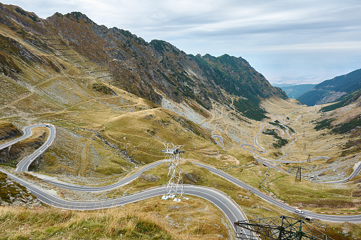 View of Transfagarash highway and valley in mountains of Romania. Tourist view mountain road. Autumn mountain landscape.