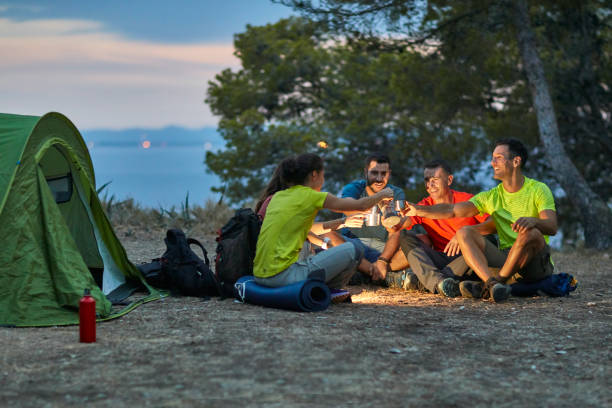 istock Spanish Friends Camping on Mediterranean Coast at Sunset 1180476534