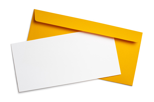 Blank white paper on a yellow envelope, isolated on white background