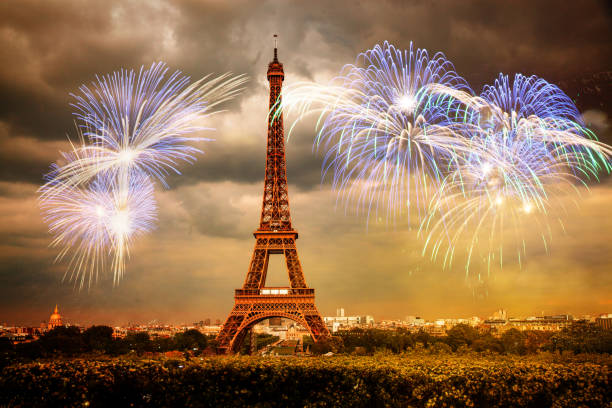 celebrating the New Year in Paris Eiffel tower with fireworks stock photo