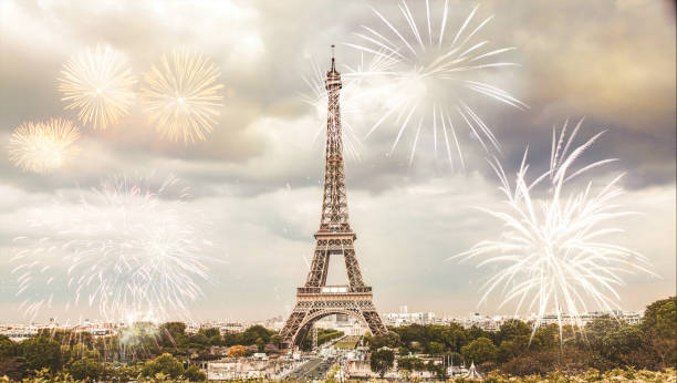 istock celebrating the New Year in Paris Eiffel tower with fireworks 1180478474