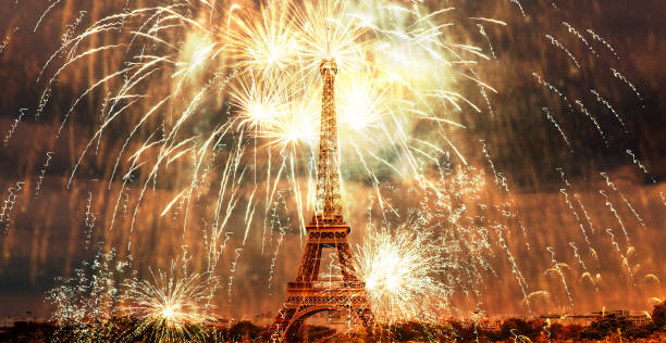 istock celebrating the New Year in Paris Eiffel tower with fireworks 1180479031