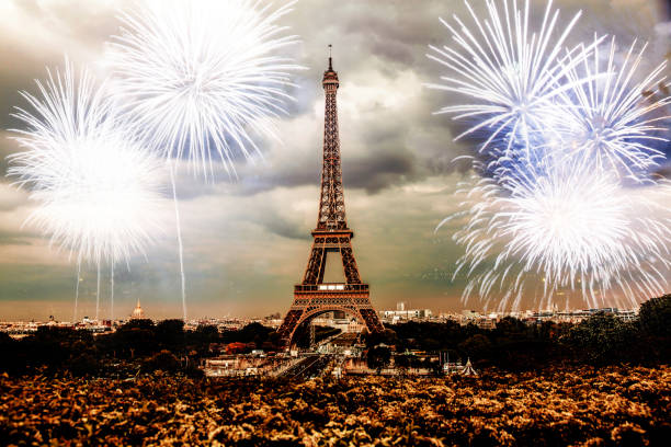 istock celebrating the New Year in Paris Eiffel tower with fireworks 1180479037