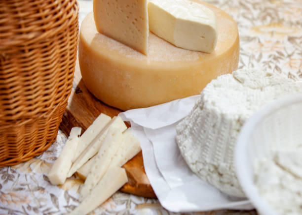 istock Fresh Ricotta and other dairy products arranged on a wooden table 1180480355
