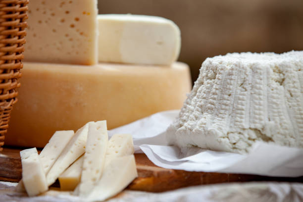 istock Fresh Ricotta and other dairy products arranged on a wooden table 1180480376