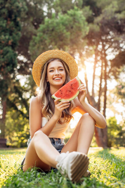 istock Happy woman with watermelon 1180481138
