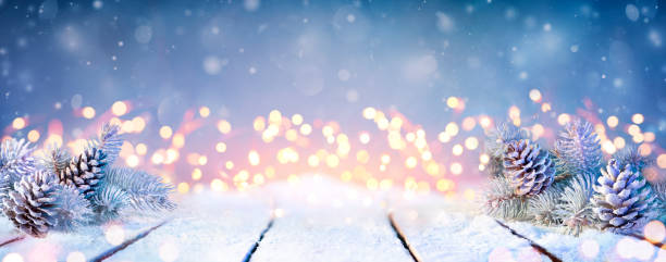 Fir Branches And Pinecones On Snowy Table And Christmas Lights
