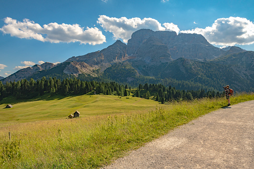 Hiker looking at the Tre Cime di Lavaredo National Park, Dolomites, European Alps, Italy,Nikon D850