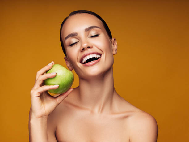 istock Beautiful girl with apple 1180484914