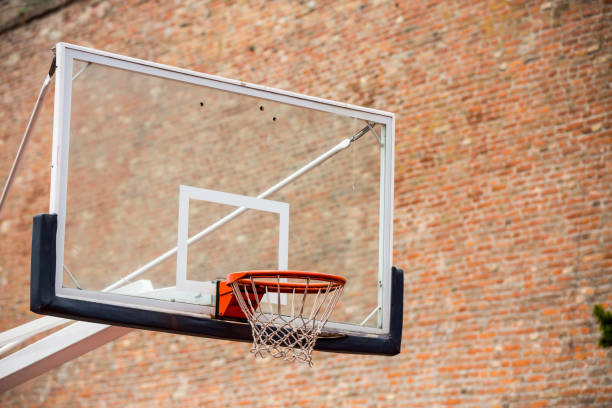 istock Basketball court by a brick wall background 1180485135