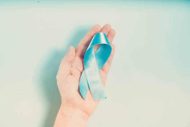 istock Hand holding Diabetes Awareness Blue Ribbon 1180485275