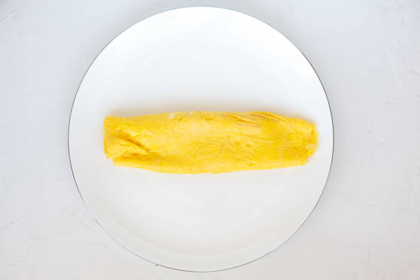 Simple french egg omelette on white background