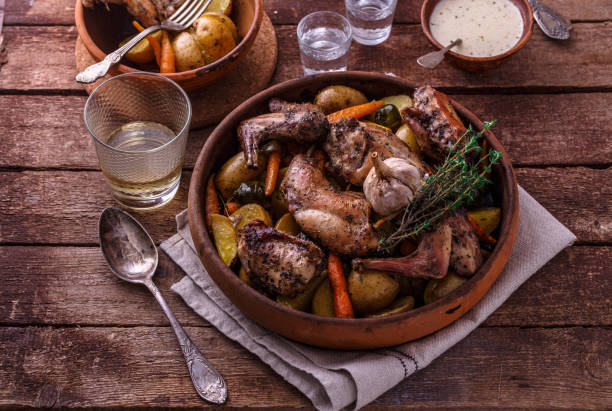 istock Baked rabbit with potato and carrots, top view 1180485330