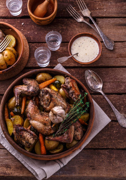 istock Oven baked rabbit with garlic sauce, copy space 1180485333