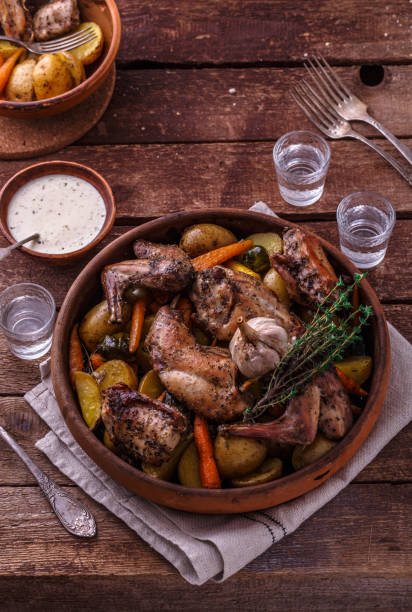 istock Oven baked rabbit with garlic sauce, copy space 1180485335