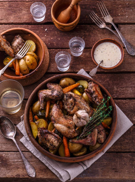 istock Rabbit with potatoes and carrots baked in a ceramic pot 1180485339