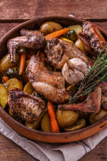 istock Close view of rabbit and potatoes in a pot 1180485356