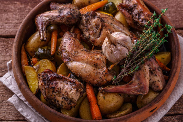 istock Close view of rabbit and potatoes in a pot 1180485364