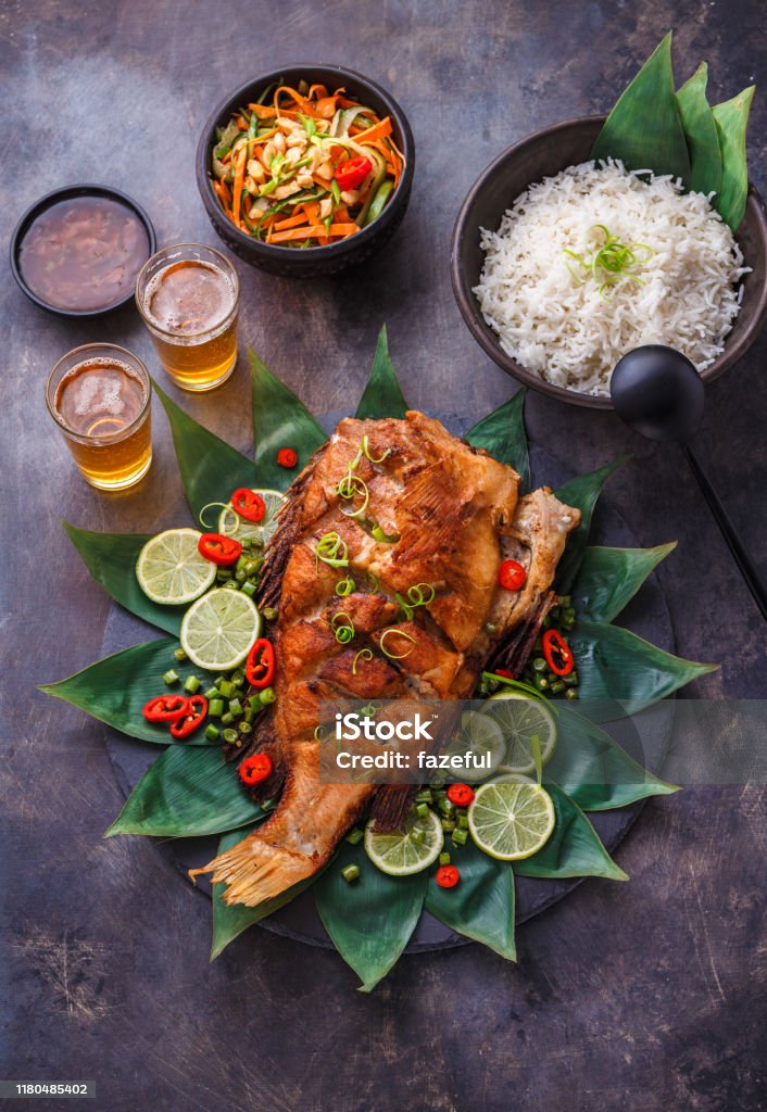 Crispy Whole Thai Fried Fish With Ginger Sauce Stock Photo - Download