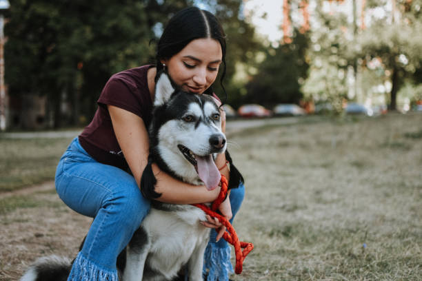 istock Young woman with dog 1180487219