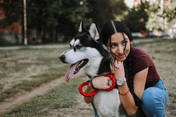 istock Young woman with dog 1180487288