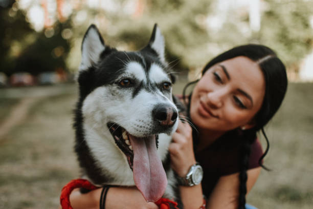 istock Young woman with dog 1180487289