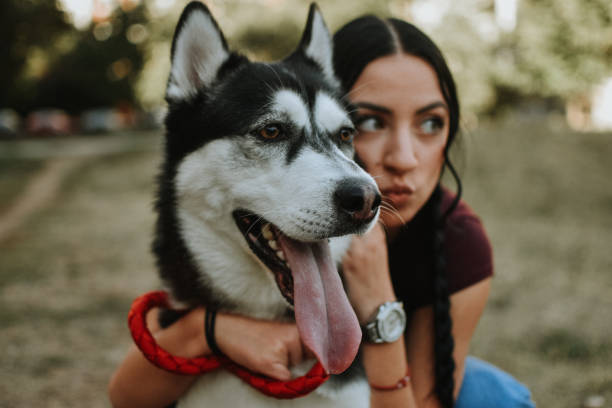 istock Young woman with dog 1180487290
