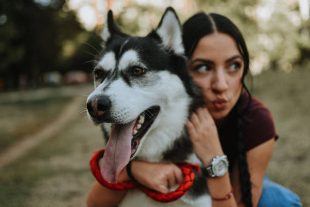 istock Young woman with dog 1180487383