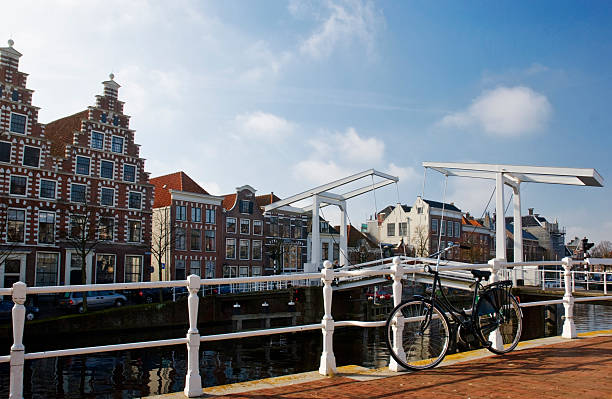 Cities; bike, bridge and canal stock photo